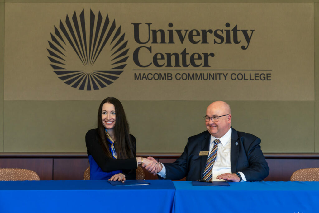 president suzy siegle and president jim sawyer official signing of articulation agreement